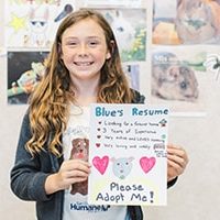 Girl Holding Dog Resume